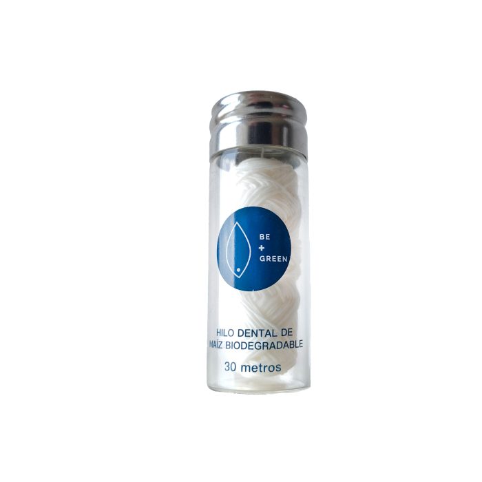 Hilo dental de maíz en envase de vidrio reutilizable de 30 metros para una higiene bucal efectiva y sostenible.